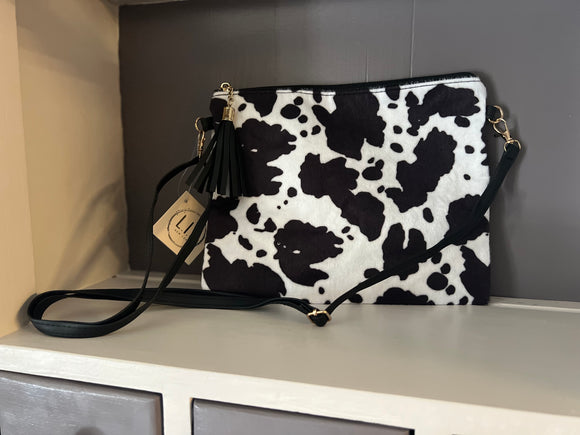 Cow print clutch with crossbody strap